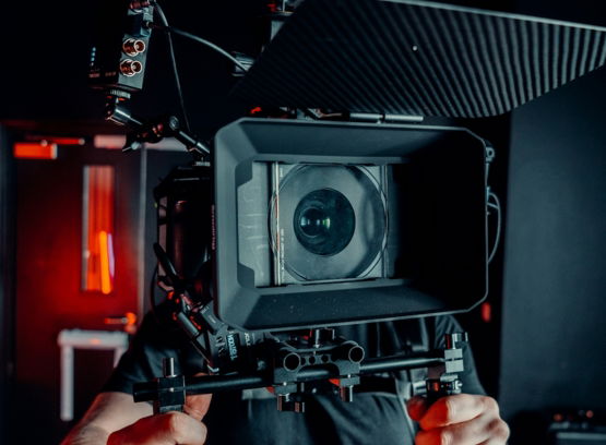 a-man-holding-a-camera-in-his-hands.jpg a man holding a camera in his hands